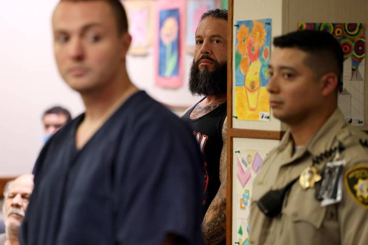 (K.M. Cannon/Las Vegas Review-Journal) Russell Smith, 26, left and Stephen Alo, 46, center hid ...