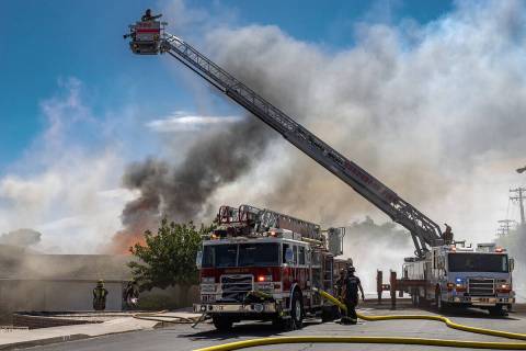 (Photo courtesy Andrew Cattoir) Boulder City firefighters work to extinguish a fire Friday, Jun ...
