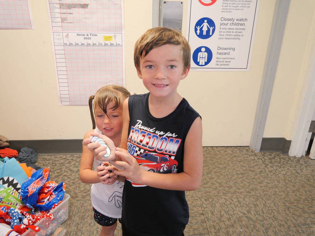 (Owen Krepps/Boulder City Review) Mackenzie, left, and Degan Dillenbeck hold up the coins that ...
