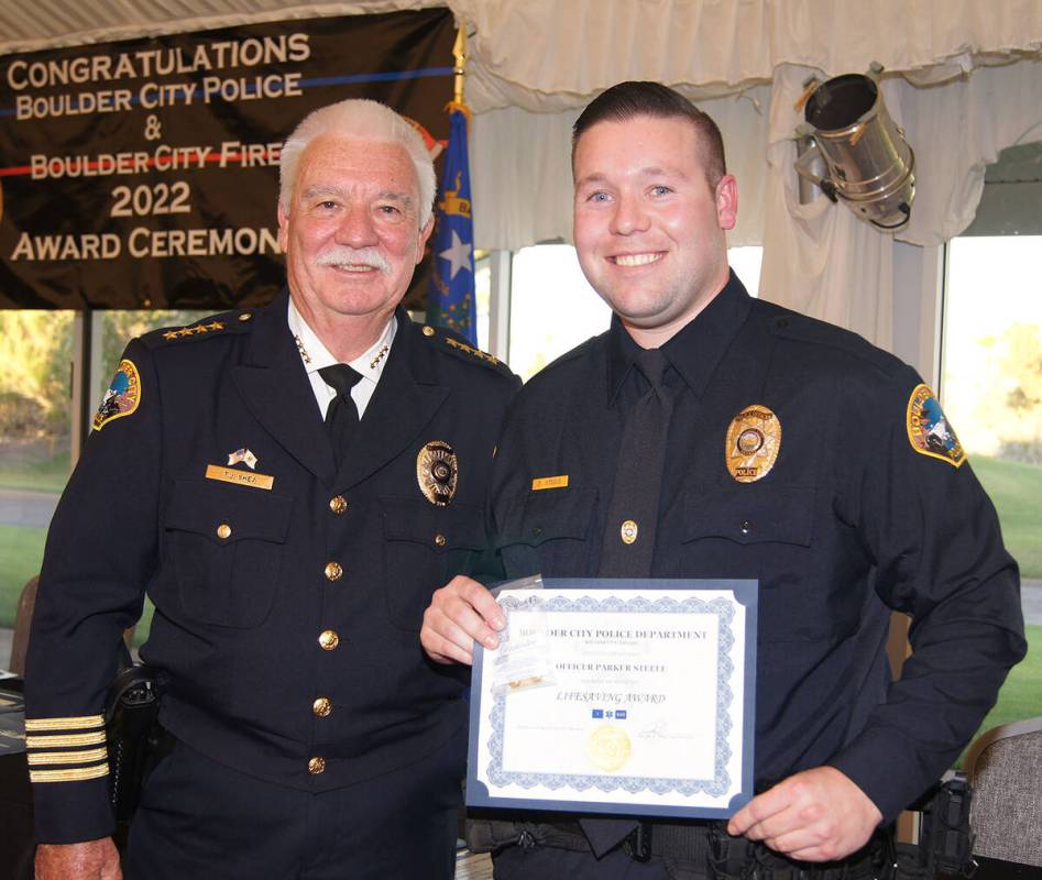 (Photo courtesy Boulder City) Boulder City Police officer Parker Steele, right, is congratulate ...