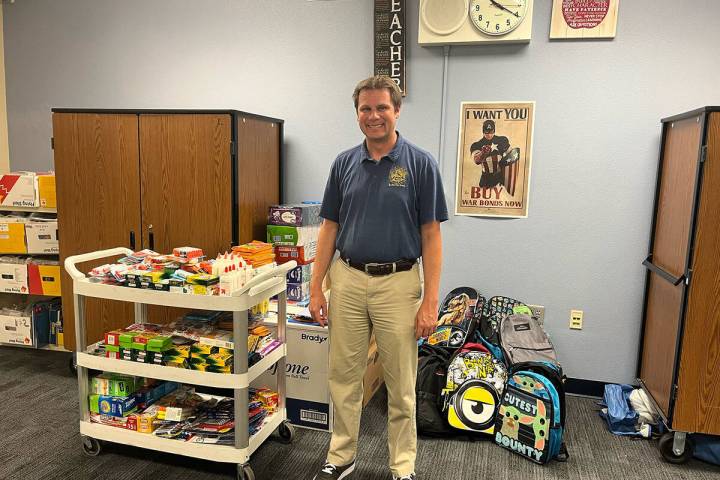 (Photo courtesy Nikole Rowe) Mitchell Elementary School Principal Benjamin Day poses with the s ...