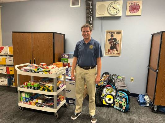 (Photo courtesy Nikole Rowe) Mitchell Elementary School Principal Benjamin Day poses with the s ...