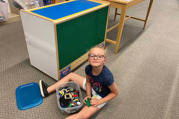 (Owen Krepps/Boulder City Review) Emma Clark plays with the new Lego wall at the Boulder City L ...
