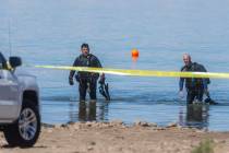 (L.E. Baskow/Las Vegas Review-Journal) Divers leave the water as authorities investigate what w ...