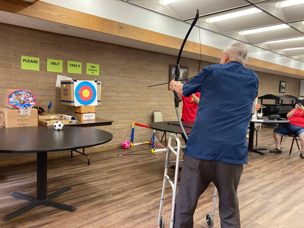 (Owen Krepps/Boulder City Review) Robert Seward, 92, aims his arrow at the target during the Bo ...