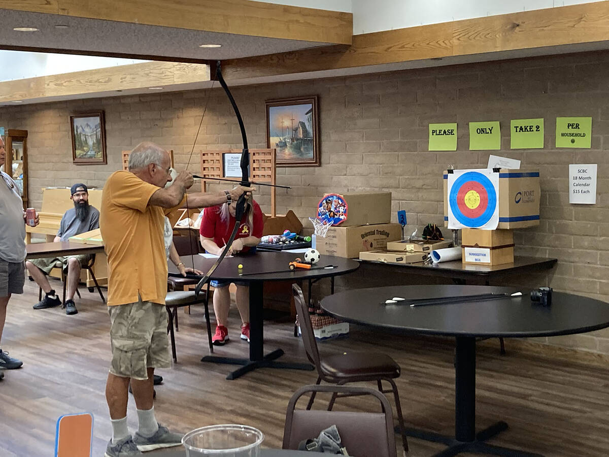 (Owen Krepps/Boulder City Review) Chuck Lacalamita shoots an arrow at the Boulder City Senior O ...