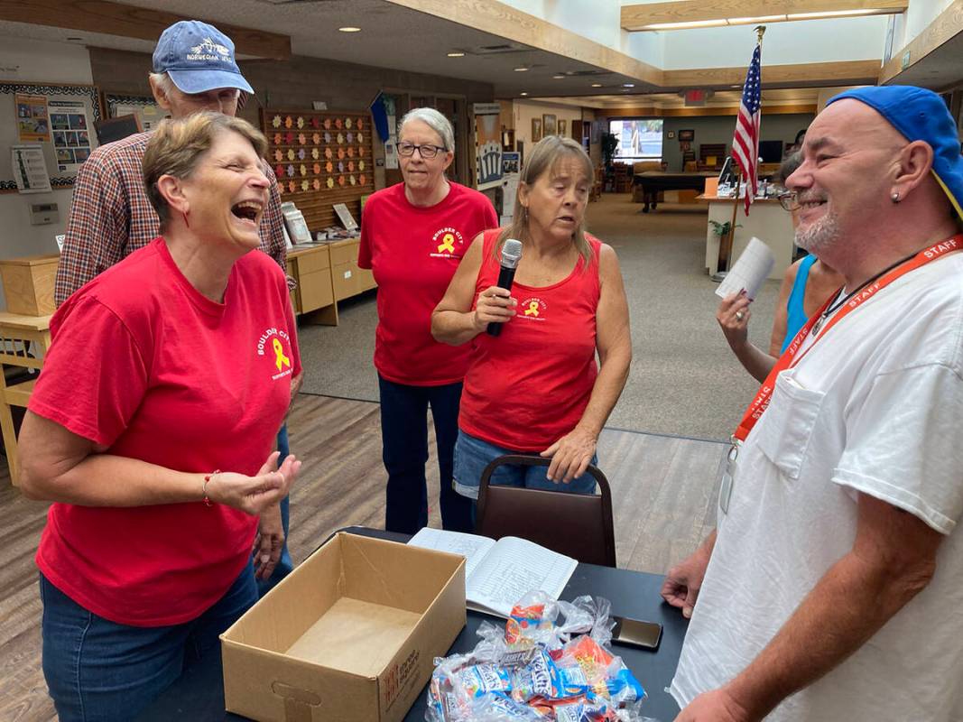 (Owen Krepps/Boulder City Review) Contestants and staff have a laugh at the high or low dice ro ...