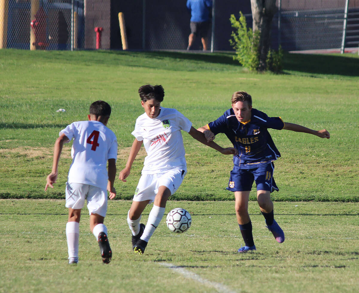 (Courtney Williams/Boulder City Review) Ben Porter takes the ball away from his opponent from S ...