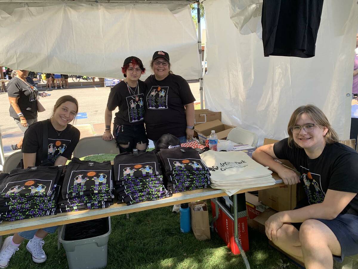(Hali Bernstein Saylor/Boulder City Review) Volunteering to help sell Art in the Park souvenirs ...