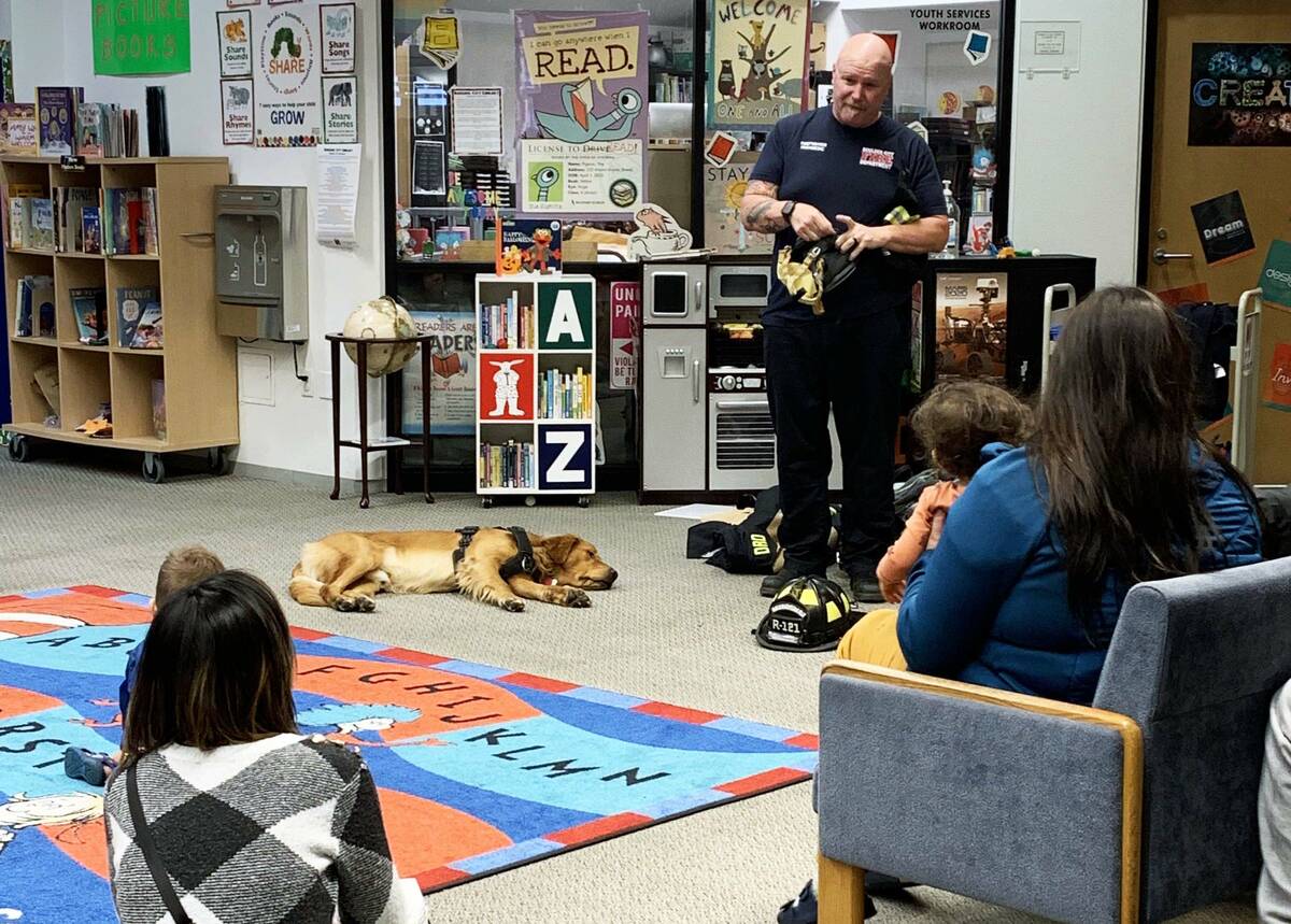(Anisa Buttar/Boulder City Review) Boulder City firefighter Walt West answers questions from a ...
