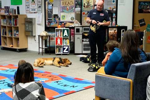 (Anisa Buttar/Boulder City Review) Boulder City firefighter Walt West answers questions from a ...