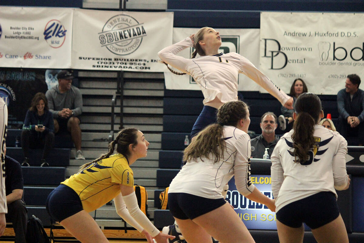 (Courtney Williams/Boulder City Review) Junior Megan Uszynski jumps up to spike the ball as the ...