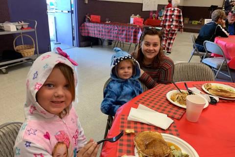 (Boulder City Review file photo) Hazel, from left, Hudson and Kaitlynn Lanning enjoyed pancakes ...