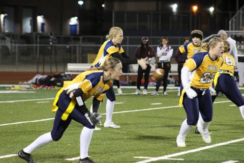 (Courtney Williams/Boulder City Review) Senior quarterback Salah Coplin, second from left, gets ...