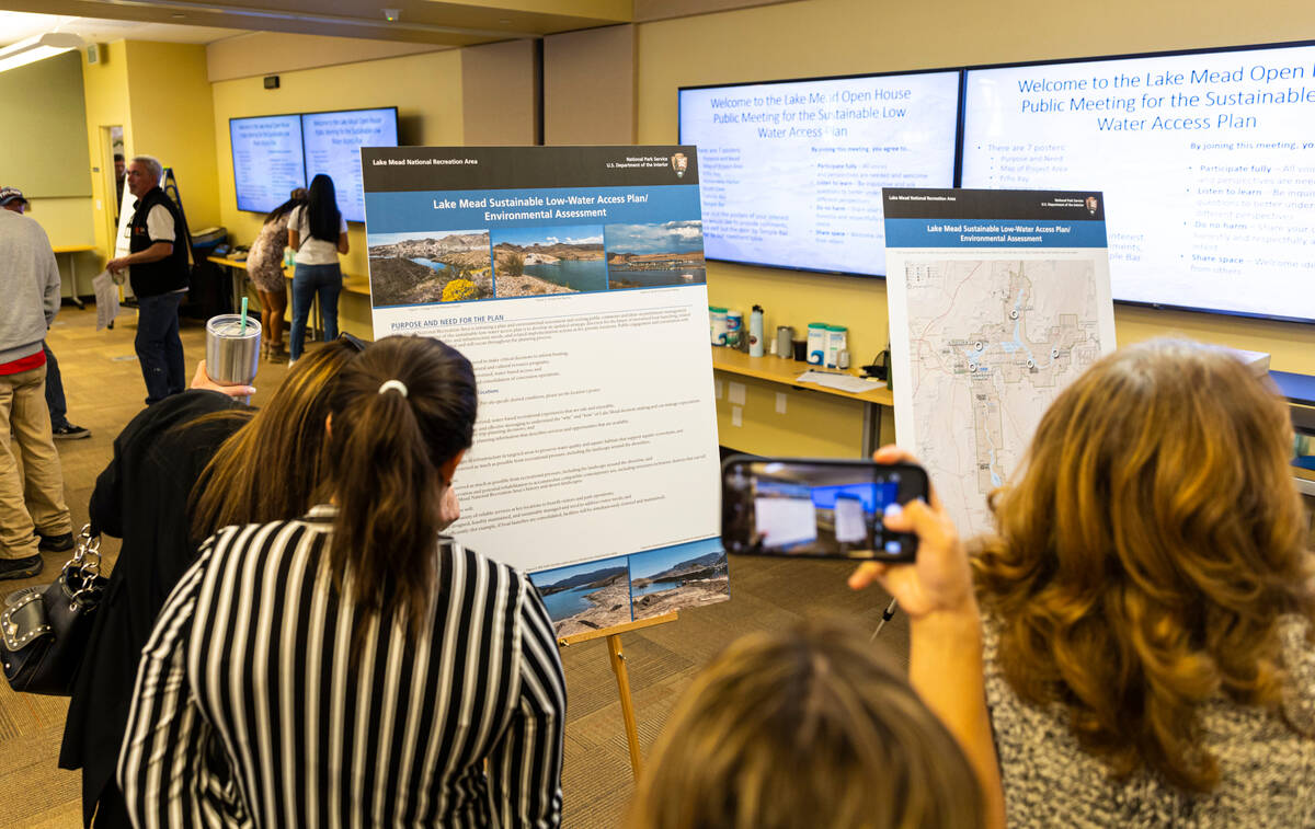 (Chase Stevens/Las Vegas Review-Journal) Attendees read informational boards during an open ho ...