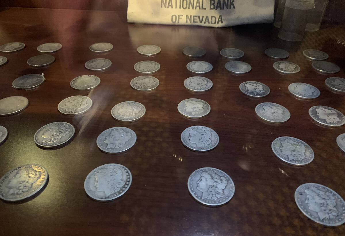 (Hali Bernstein Saylor/Boulder City Review) More than 50 silver dollars dating back to the 1870 ...
