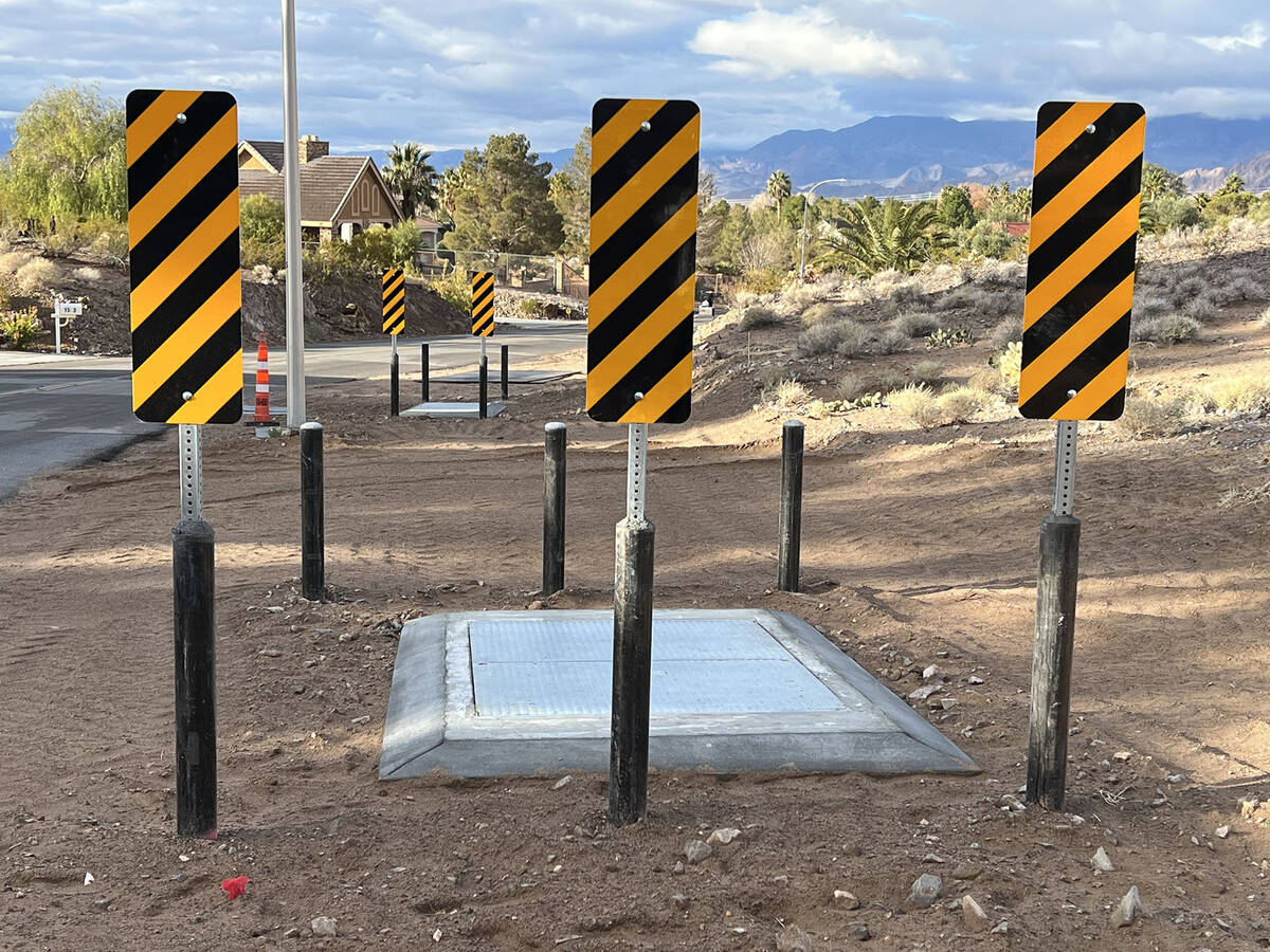 (Photo courtesy Rod Woodbury) Bollards, topped with striped warning signs, have been placed aro ...