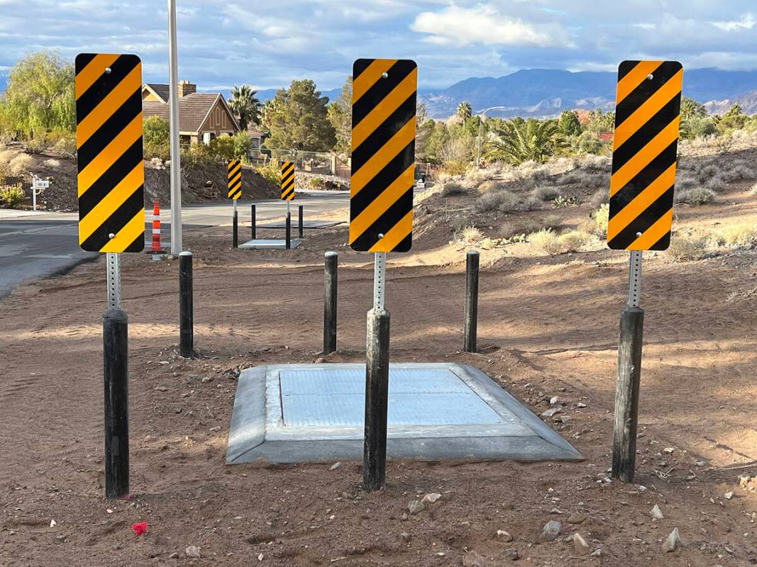 (Photo courtesy Rod Woodbury) Bollards, topped with striped warning signs, have been placed aro ...