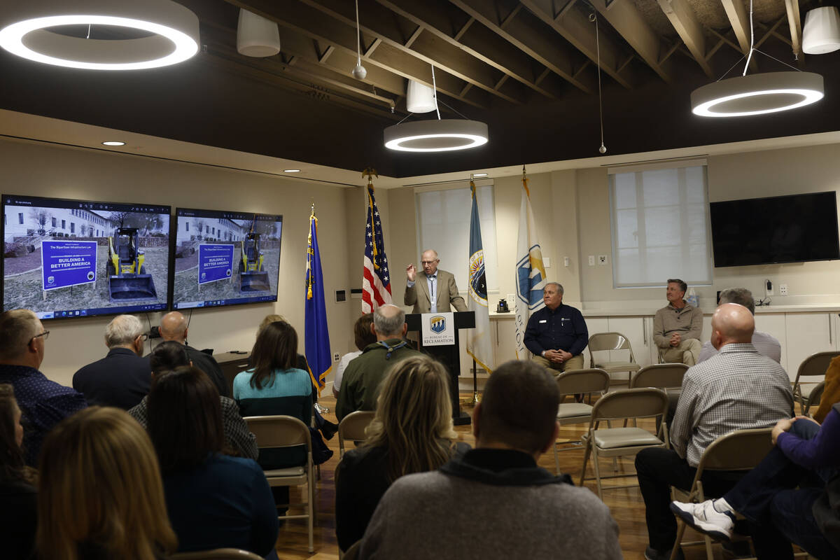 Boulder City Mayor Joe Hardy, left, speaks during a groundbreaking on a xeriscape project, Frid ...