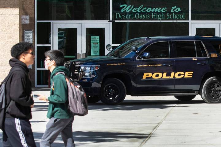 The Clark County School district police vehicle is seen as students at Desert Oasis High School ...