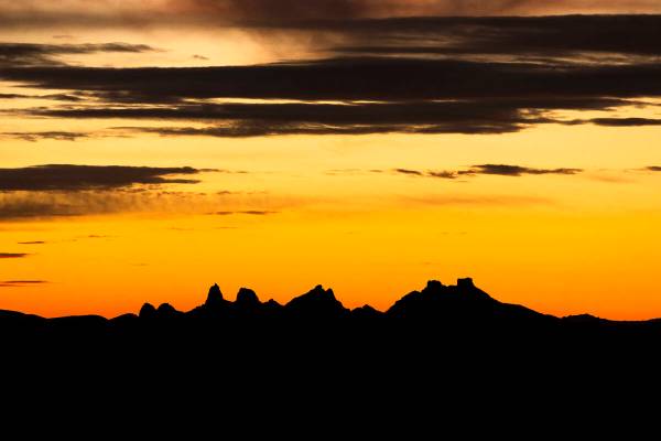 The sun sets beyond the Castle Mountains within the Avi Kwa Ame National Monument on Monday, Fe ...