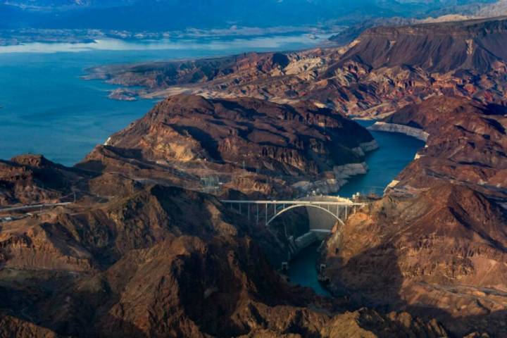 Hoover Dam with the lower Lake Mead shoreline, above, and Colorado River continuing below on Ma ...