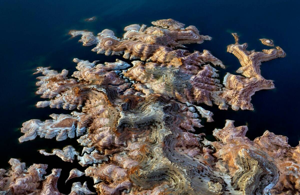 The receding Lake Mead shoreline creates an artistic pattern from above on March 6, 2023, in La ...