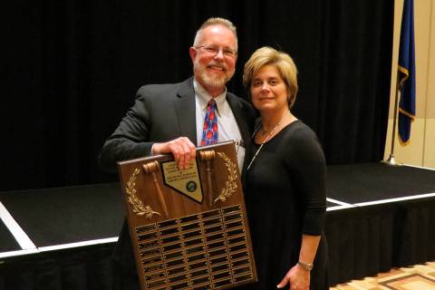 Judge Victor Miller receives the 2018 Judge of the Year award from Judge Diana Sullivan of the ...