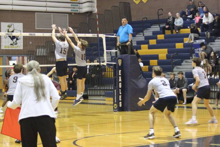 Tyler Lemmel and Roman Rose go up for a block during action last week. (Courtney Williams/Bould ...