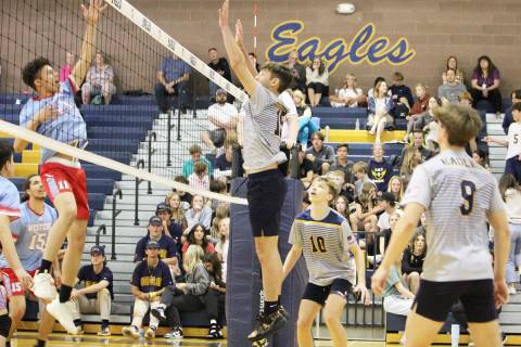 (Courtney Williams/Boulder City Review) Tyler Lemmel goes up for a block with assistance from ...
