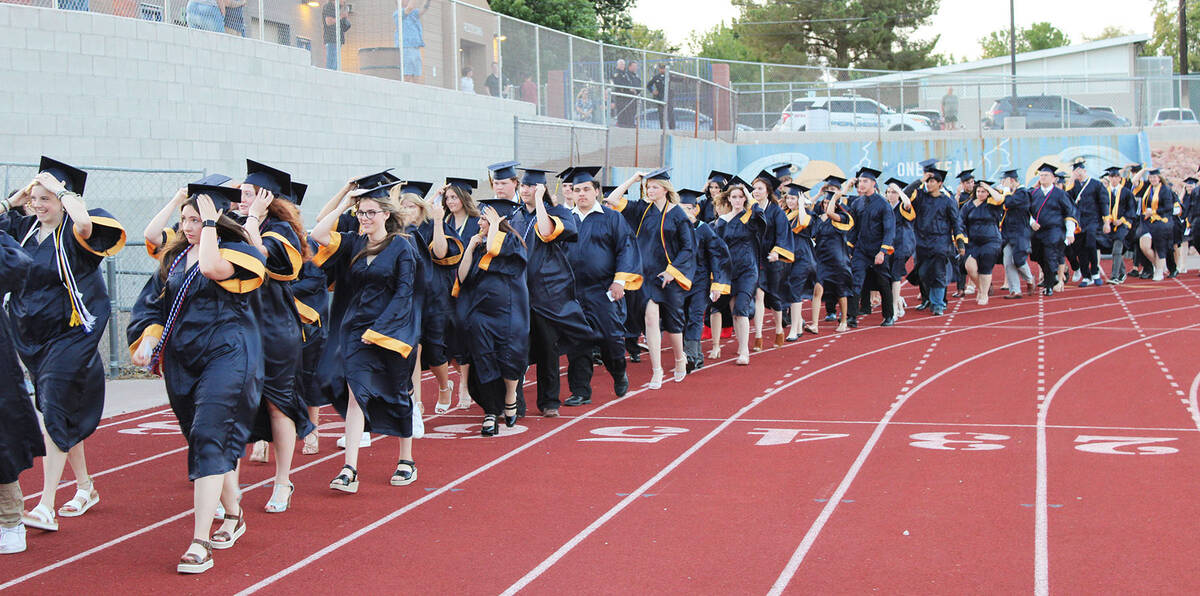 Ron Eland/Boulder City Review High winds forced the graduates to hold onto their caps as they e ...