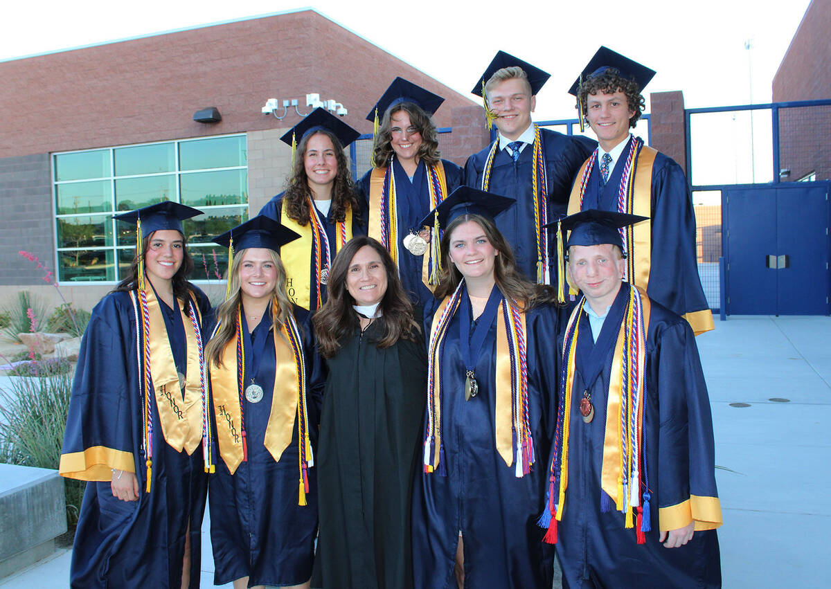 Ron Eland/Boulder City Review Advisor Cheryl Herr poses with the graduting members of the schoo ...