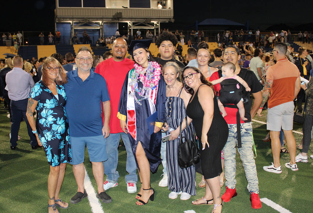 Ron Eland/Boulder City Review Following the ceremony, family and friends came onto the field to ...