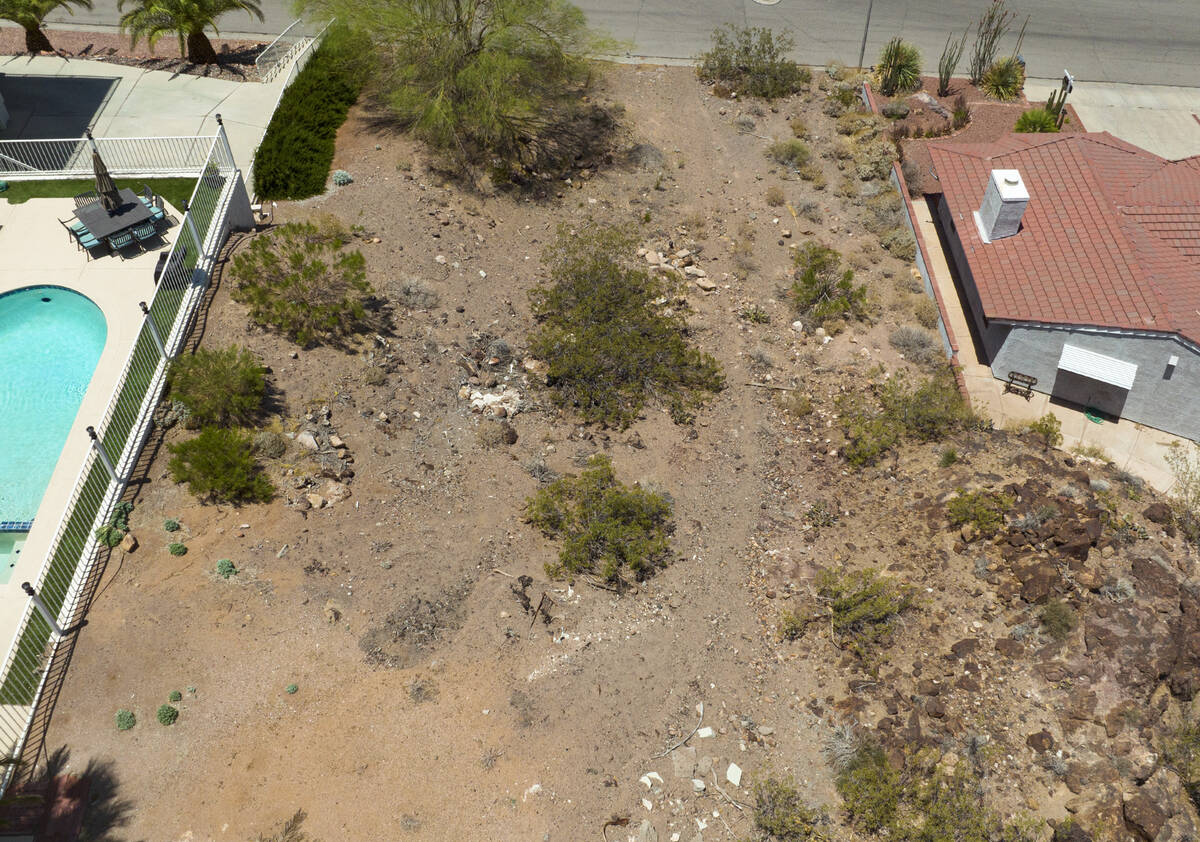 A vacant homesite, center, is seen at the corner of Judi Place and Isabel Drive, on June 2, 202 ...