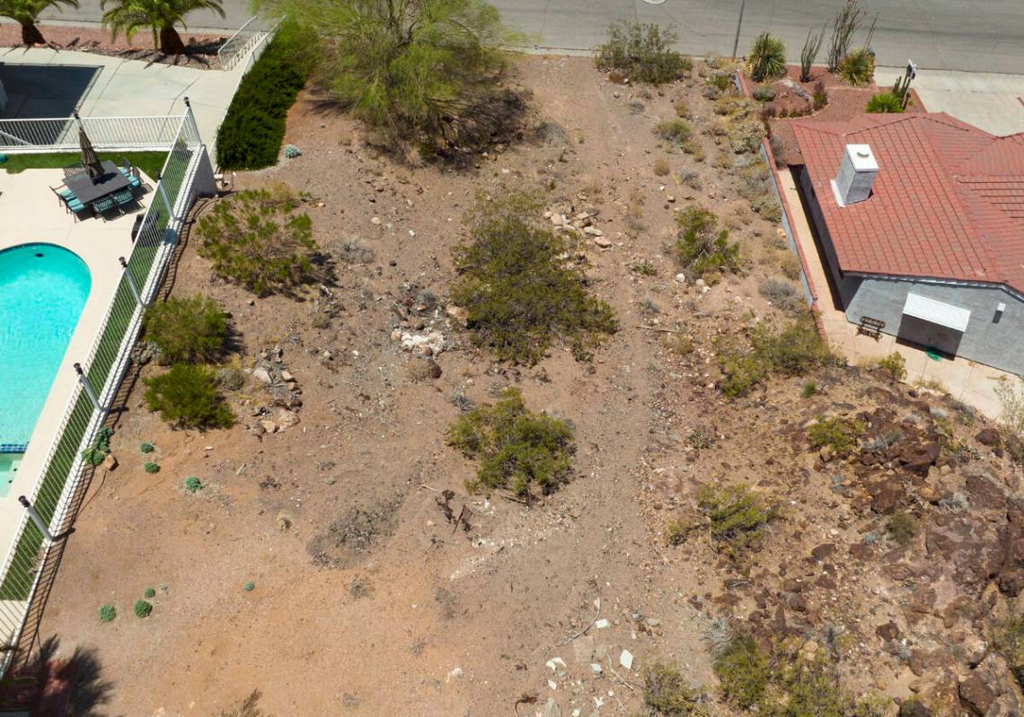 A vacant homesite, center, is seen at the corner of Judi Place and Isabel Drive, on June 2, 202 ...