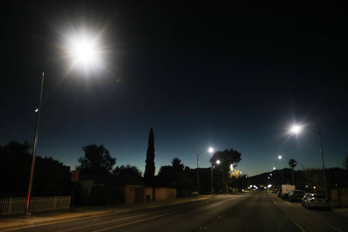 Street lights that are in the process of being retrofitted to give off less luminance and conse ...
