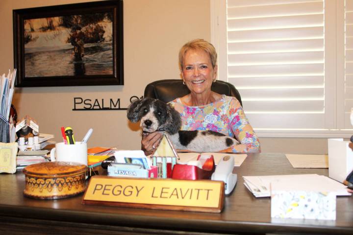 Ron Eland/Boulder City Review Peggy Leavitt, along with her dog Riley, in her home office. The ...