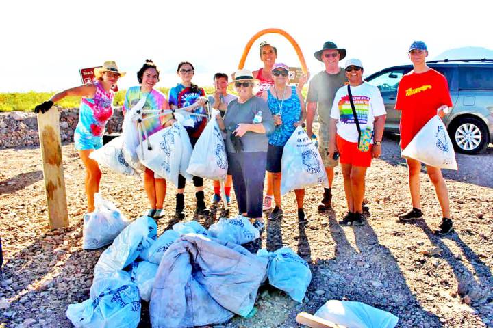 Courtesy photo More than a dozen people turned out for Friday's beach cleanup, which brought in ...