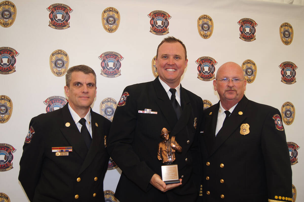 Photo courtesy City of Boulder City Carl Ford, center, seen here receiving an award earlier thi ...