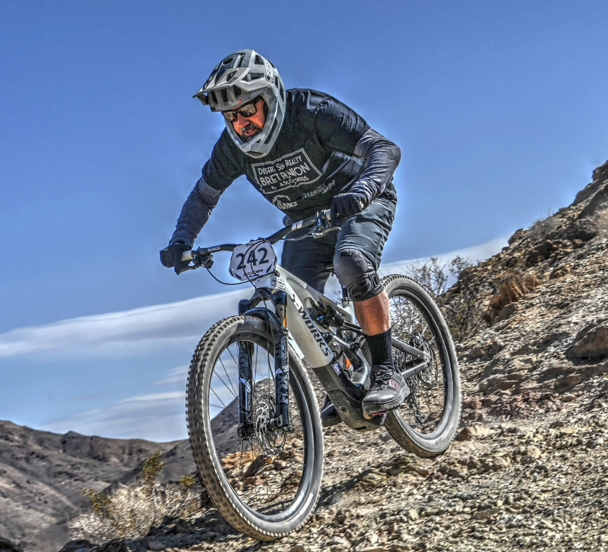 Photo courtesy SoStokedAerial Bret Runion, owner of Desert Sun Realty, took up mountain biking ...