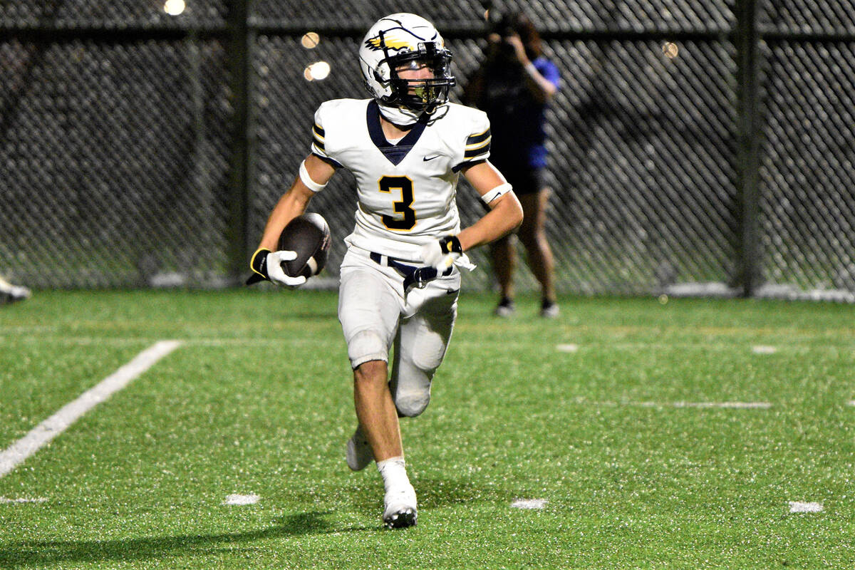 Robert Vendettoli/Boulder City Review Junior Easton Welbourne takes a pass to the house midway ...