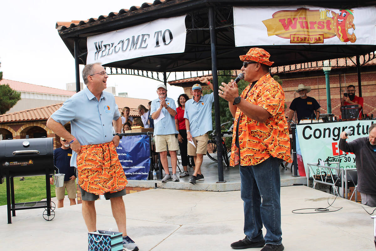 Emcee Mike Pacini, right, presented his longtime friend Eric Estes with a retirement outfit Sat ...