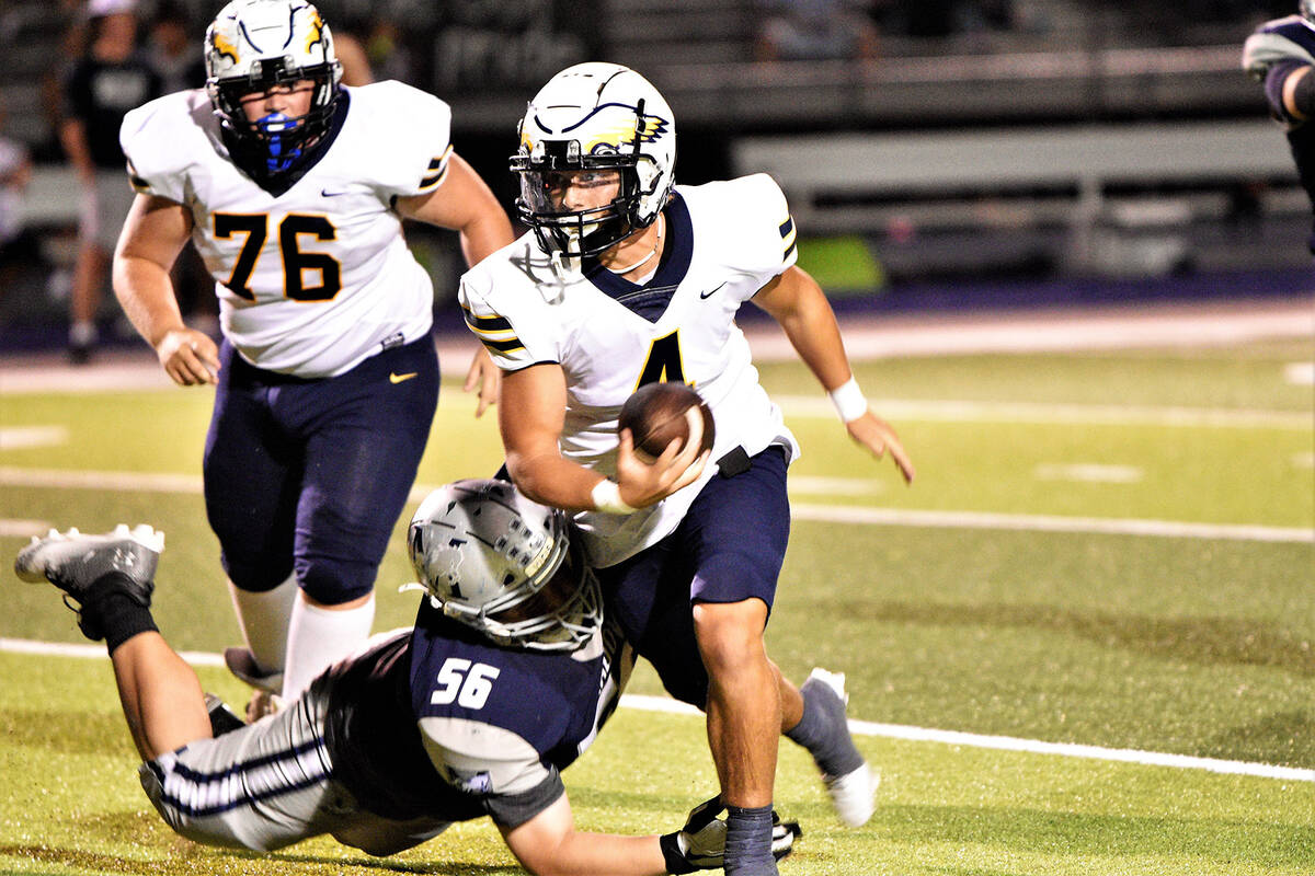 Robert Vendettoli/Boulder City Review A lethal scrambler, junior quarterback Gage Hopkinson rus ...