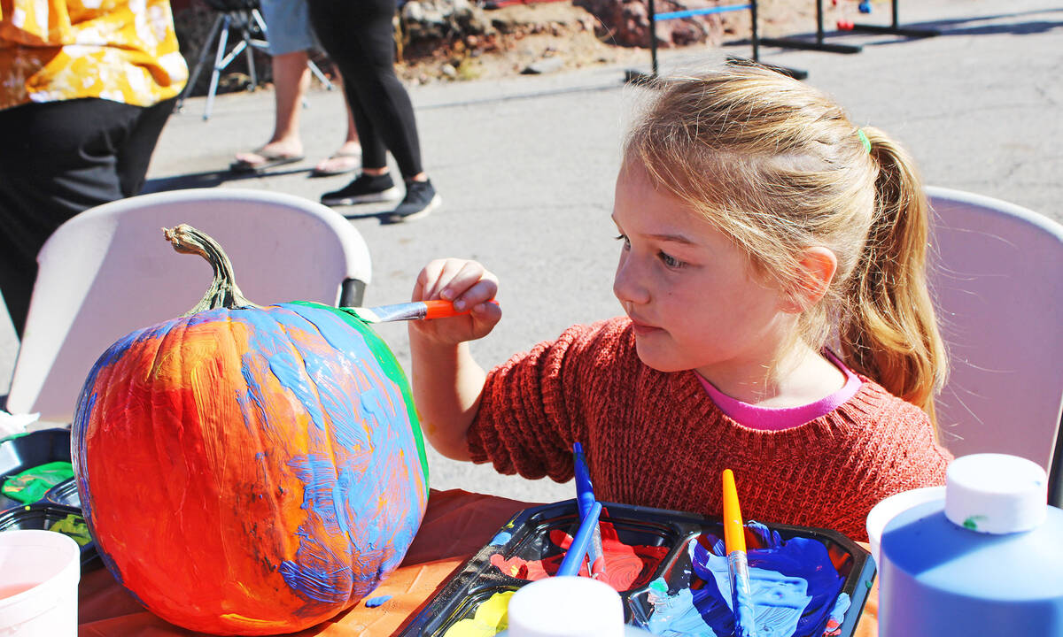 Gemma Clift, 5, painted her pumpkin at the Great Southwest Pumpkin Patch, which also featured a ...