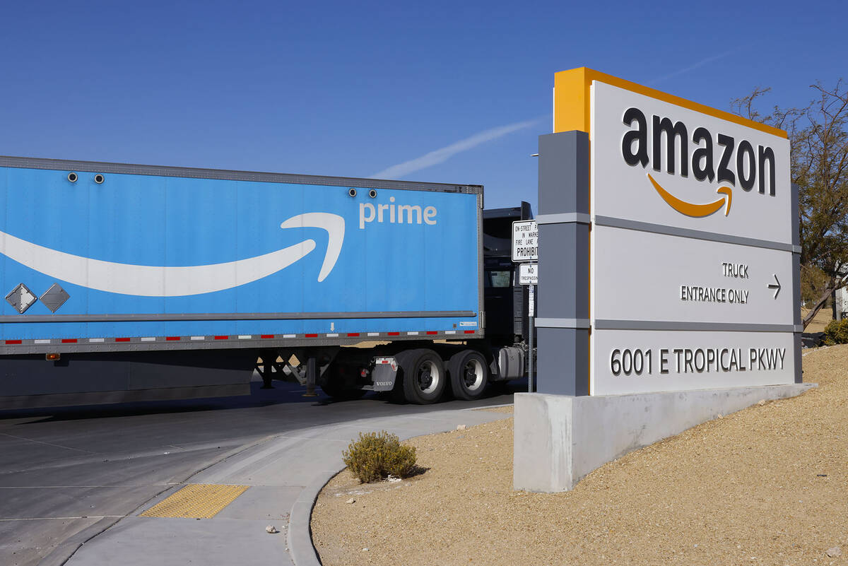 An Amazon Prime truck enters Amazon Distribution Center at an industrial area centered around T ...