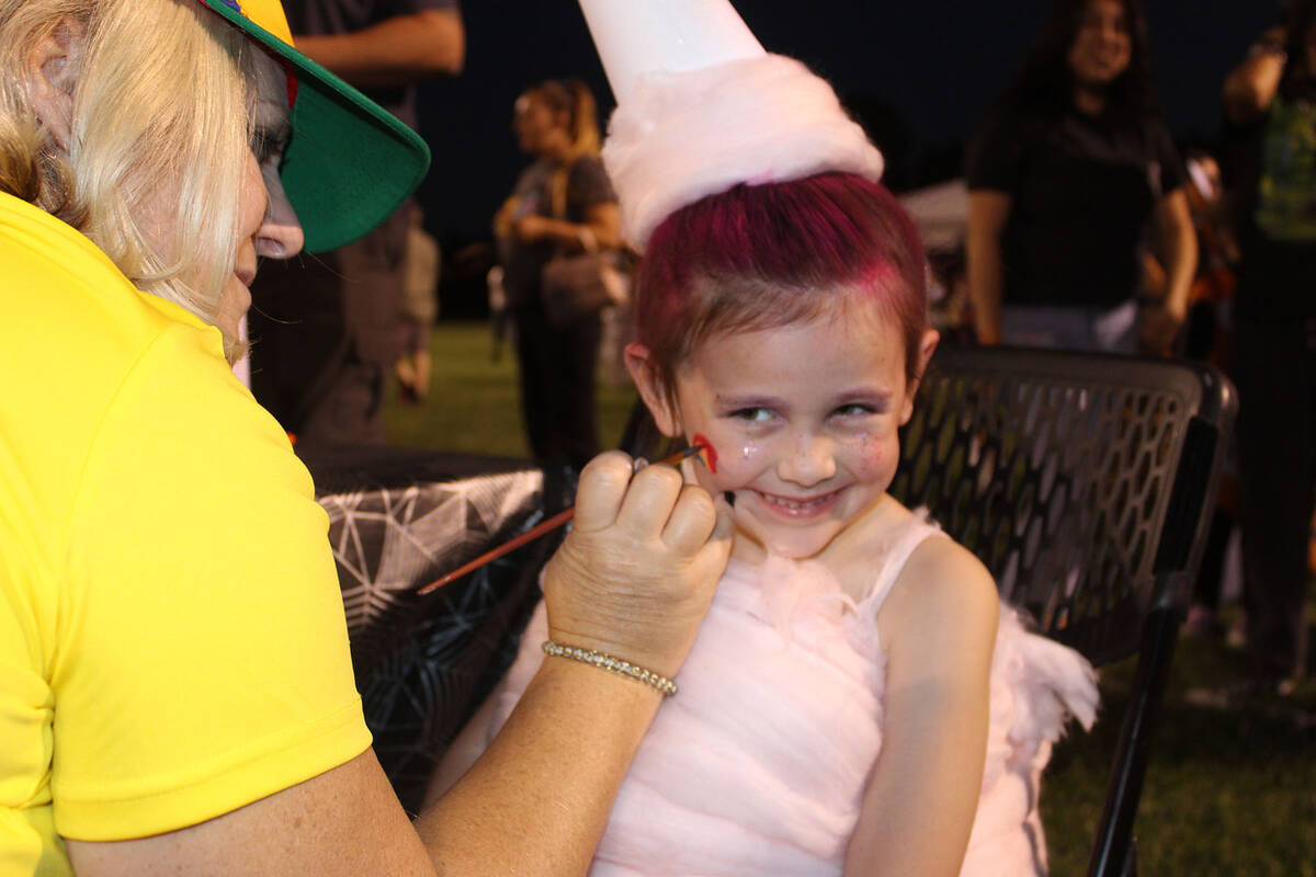 Six-year-old Scarlett Senef was all smiles as she got her face painted. She and her younger sis ...