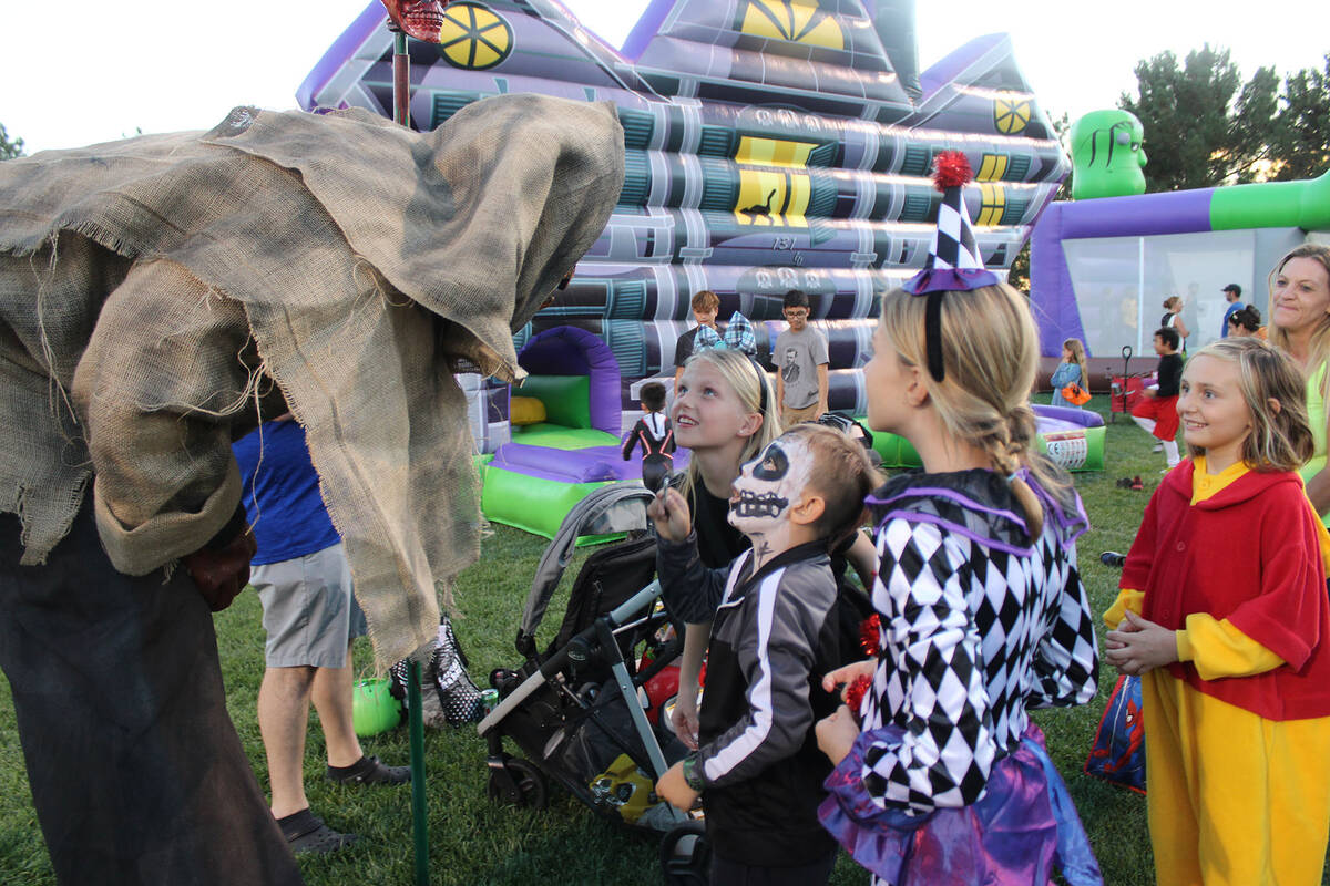 Scary Pumpkin Man, who took first for best costume in the adult category, was a hit with the kids.