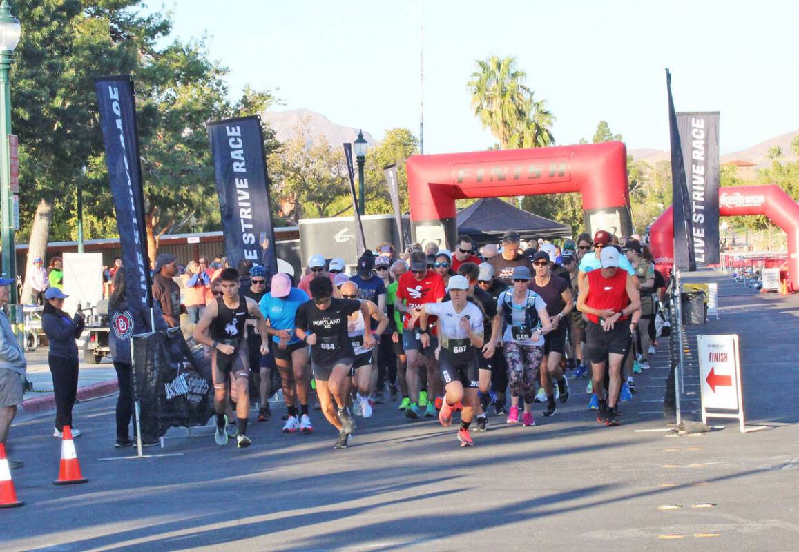 Competitors in the 5K and 10K runs take off from the starting line Saturday.