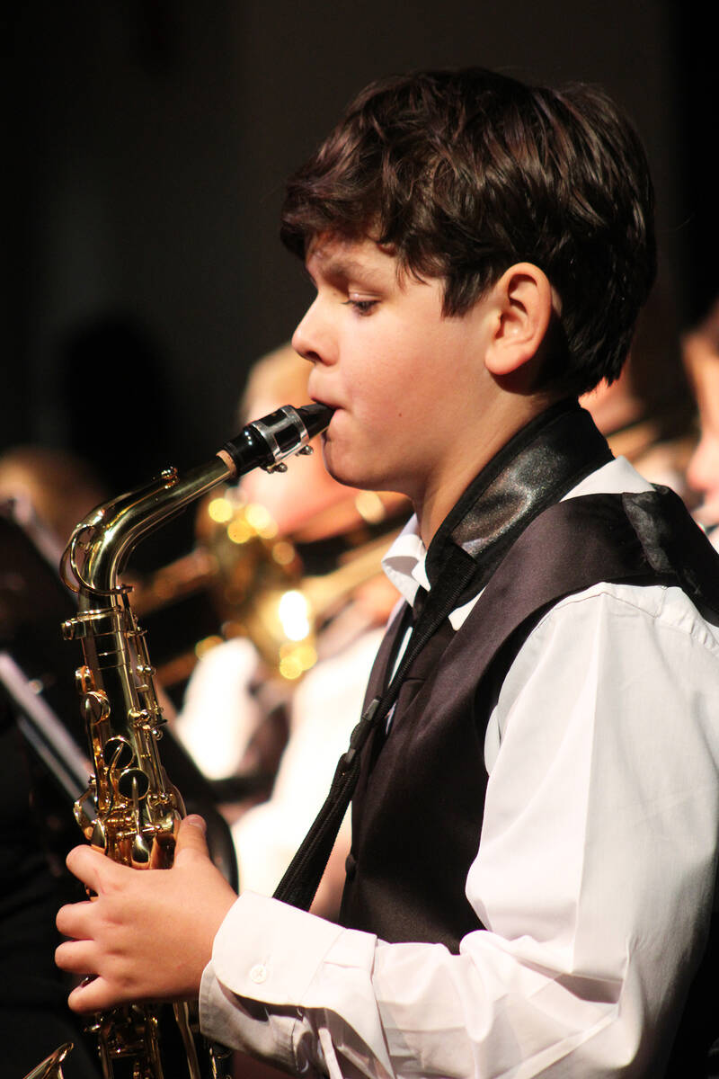 Landyn Rowe plays the saxophone during the winter concert.