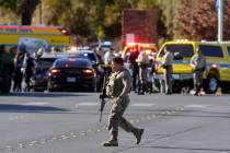 Police evacuate students on Harmon Avenue near Maryland Parkway after a shooting on the UNLV ca ...